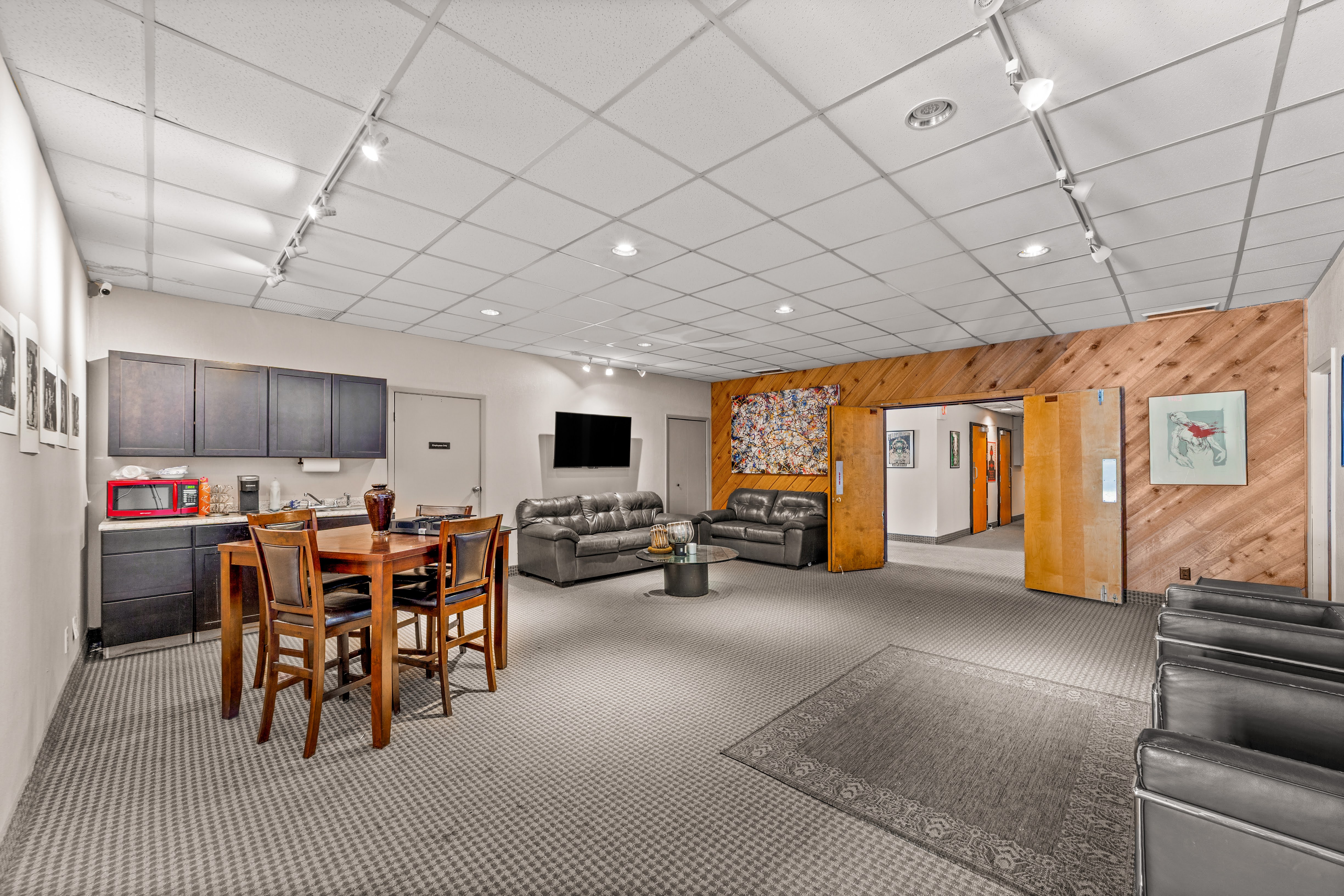 Large multi-purpose room with kitchenette and lounge area