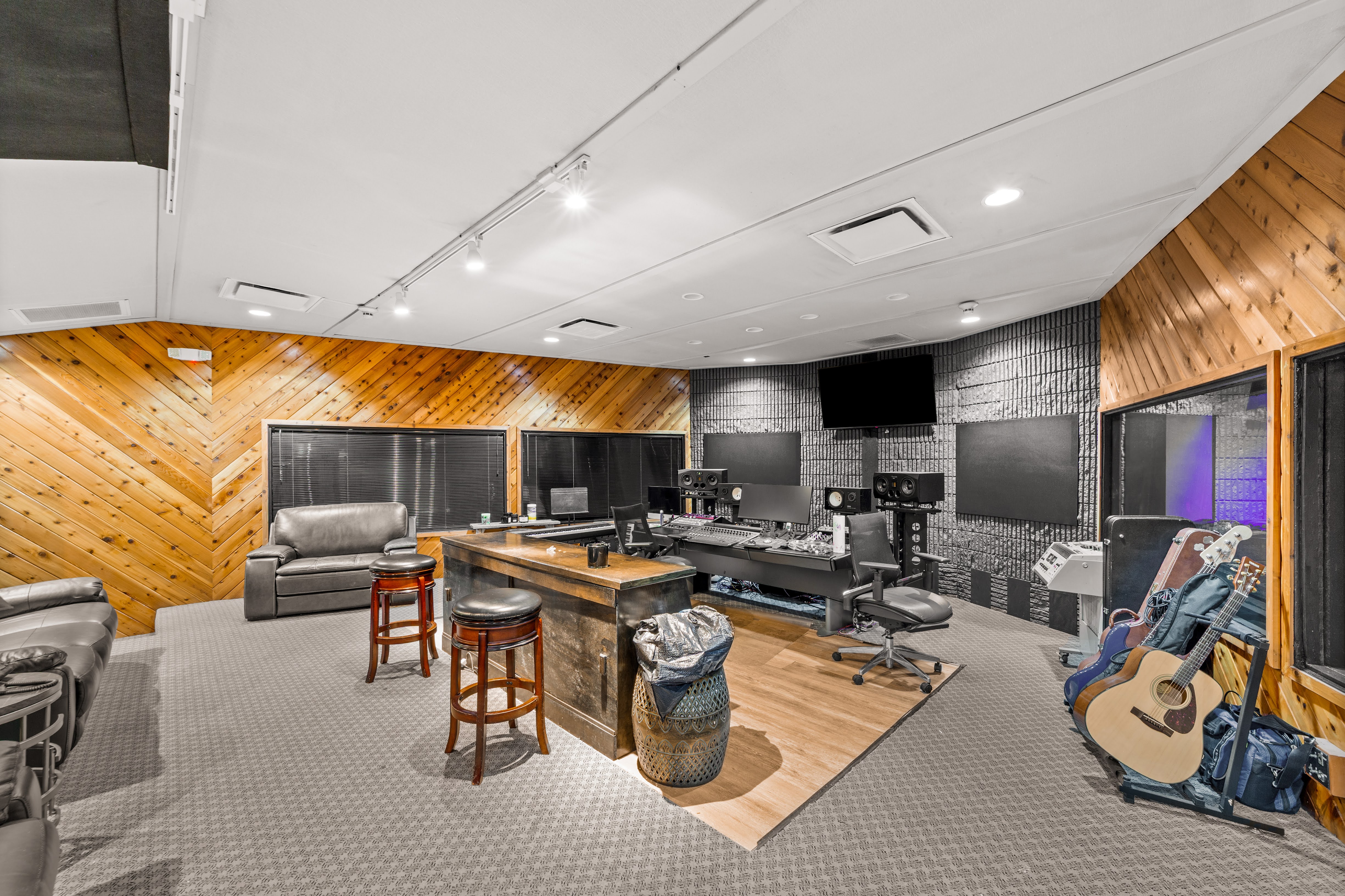 Modern music recording studio control room with mixing console