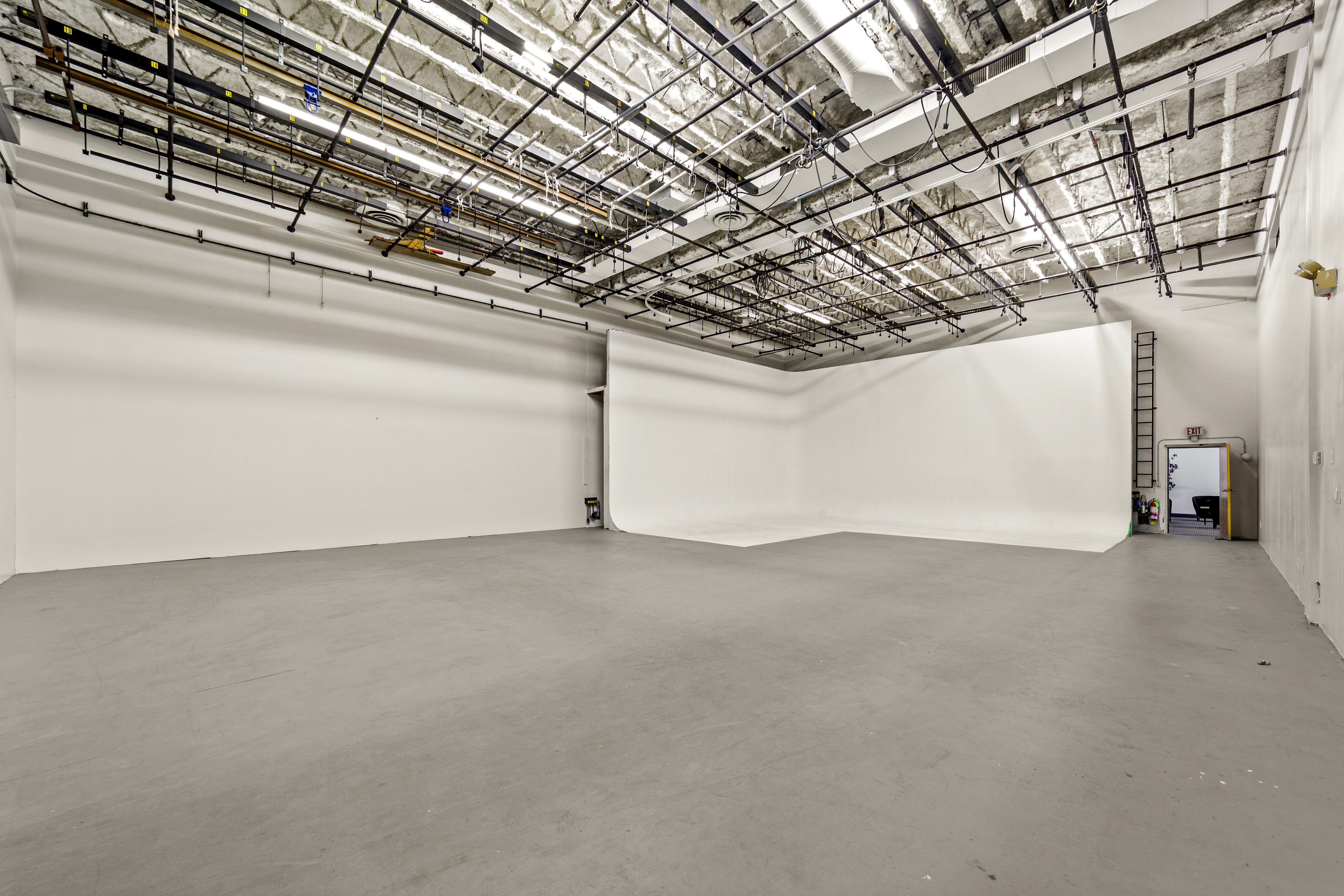 Empty studio space with white cyclorama wall