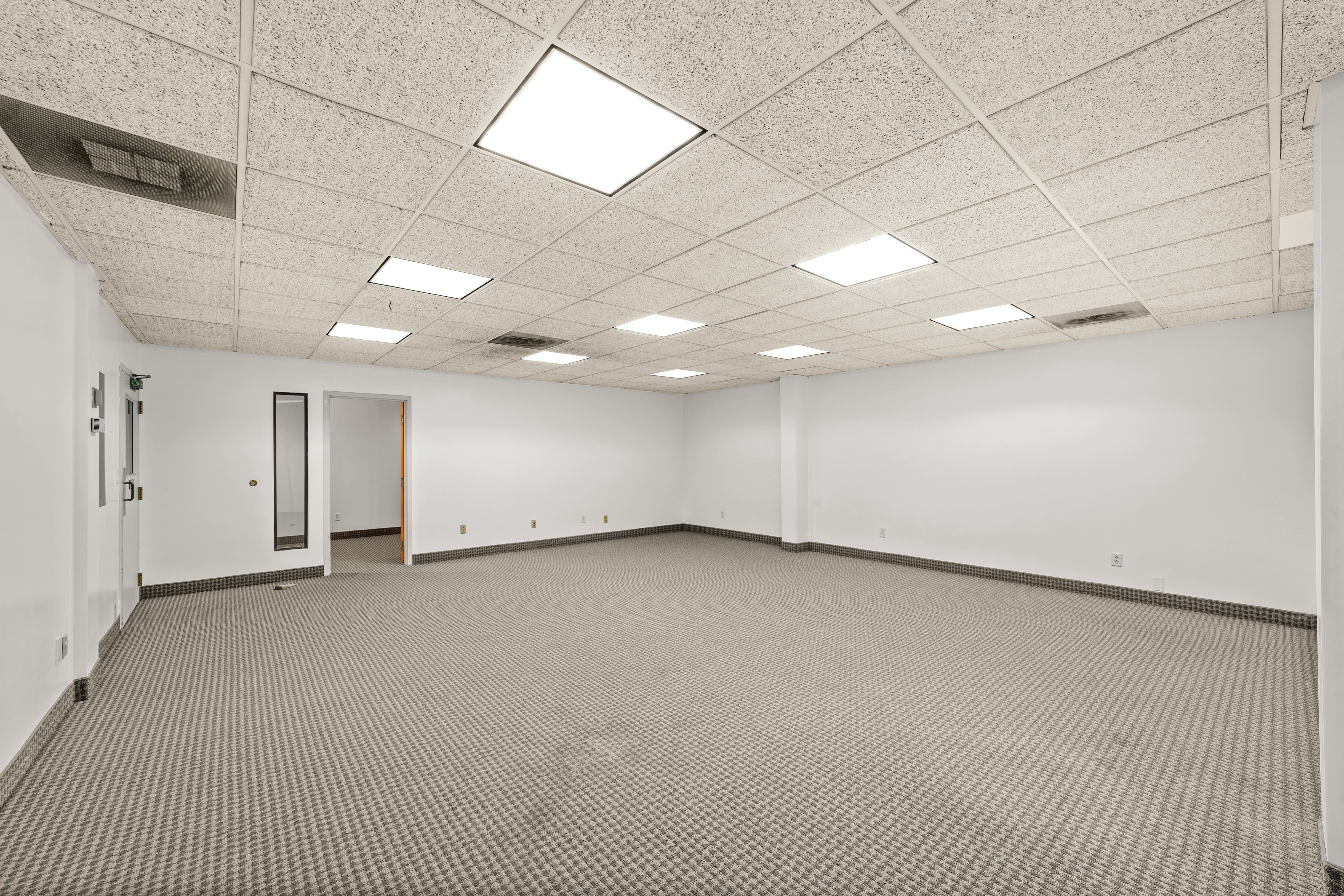 Empty commercial or office space with multiple doorways