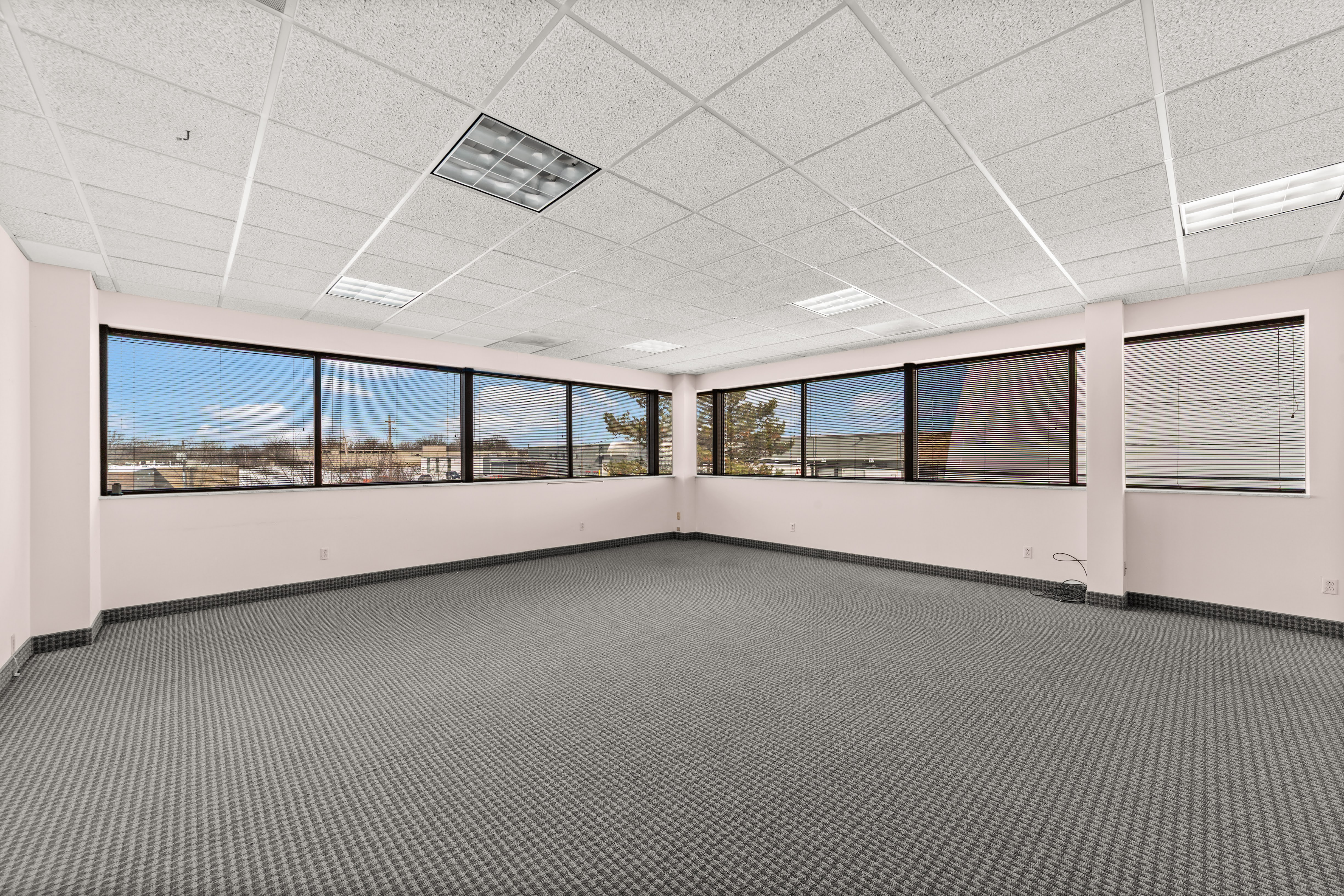 Empty office room with multiple windows