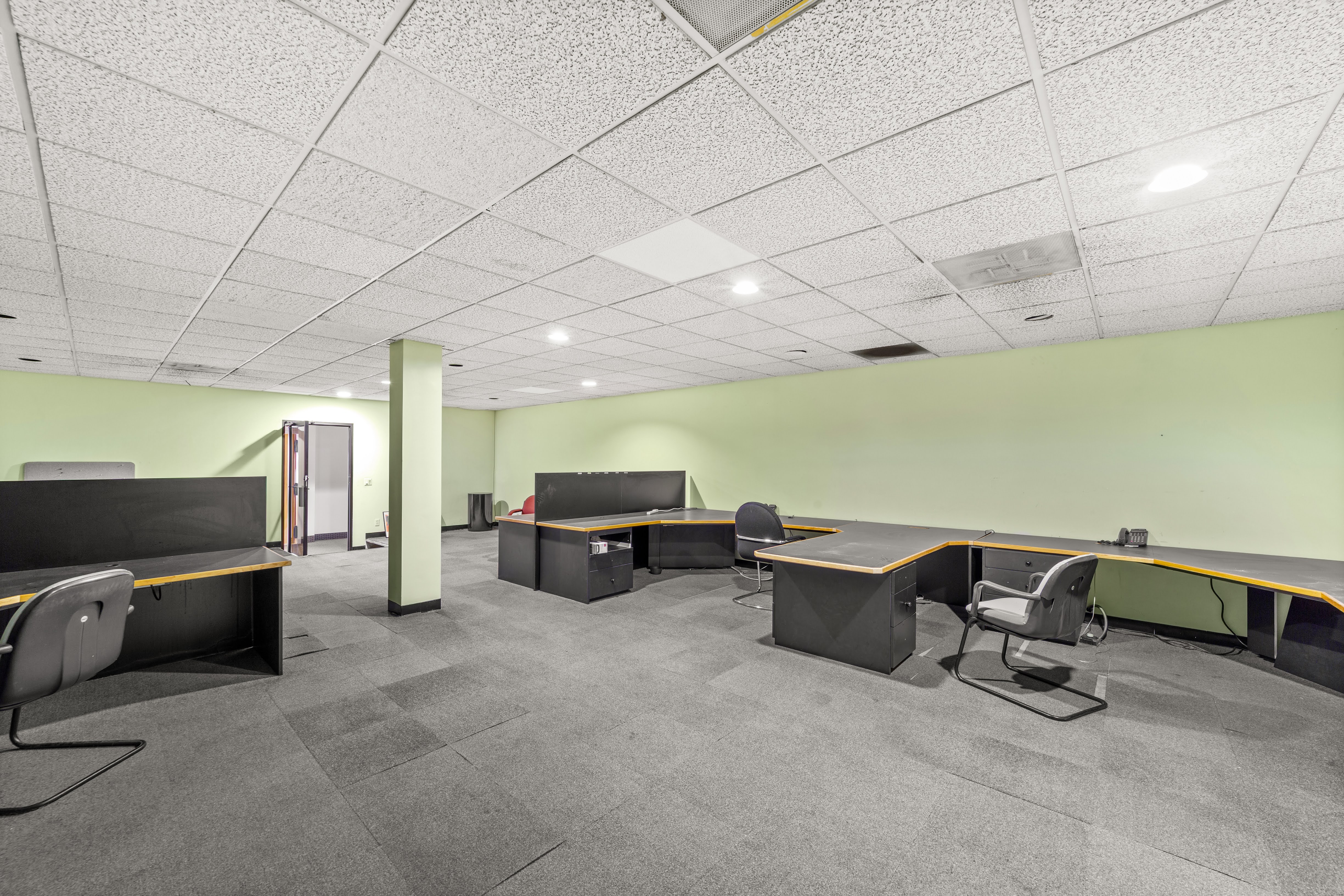 Vacant office space with light green walls