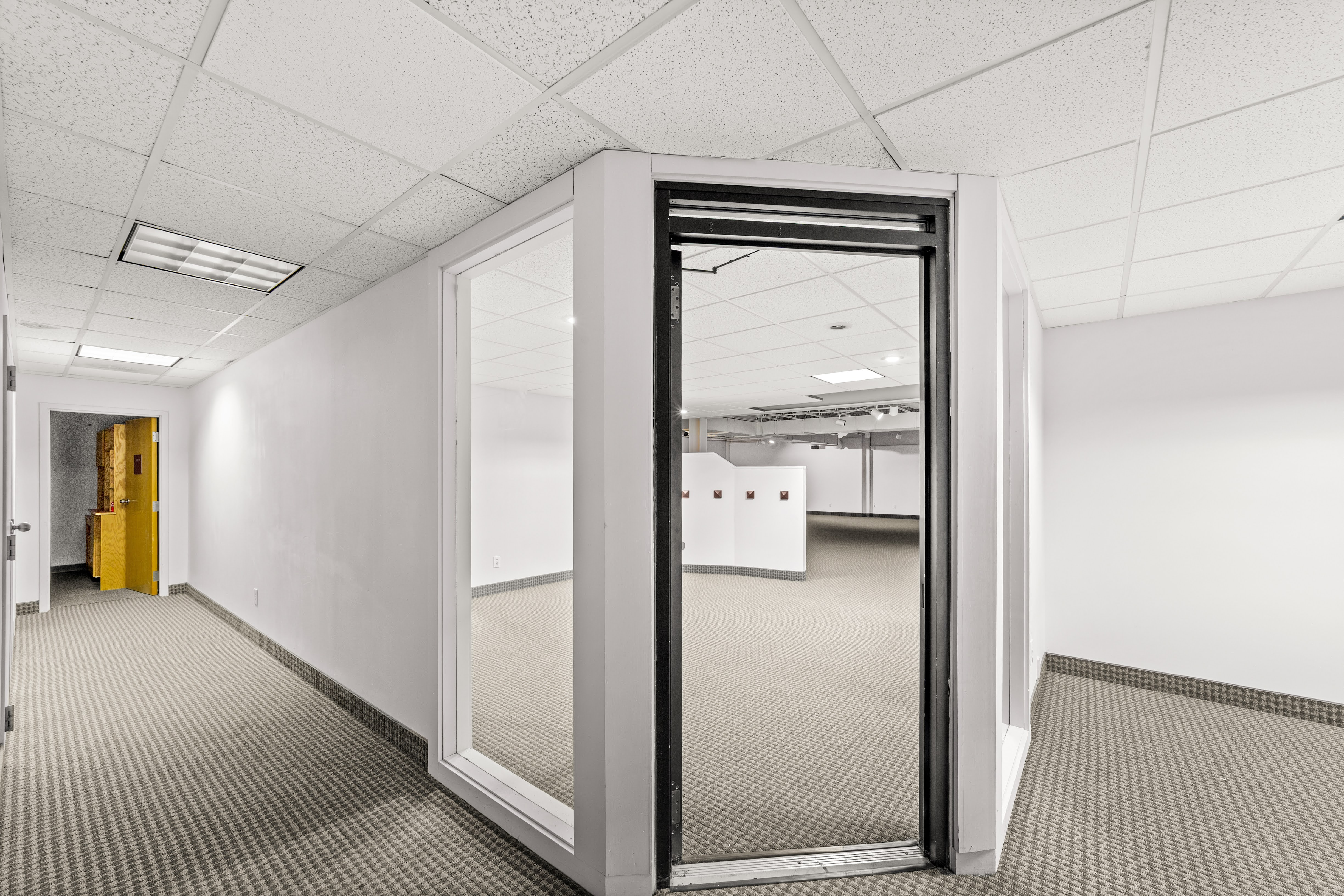 Commercial interior with glass-walled office
