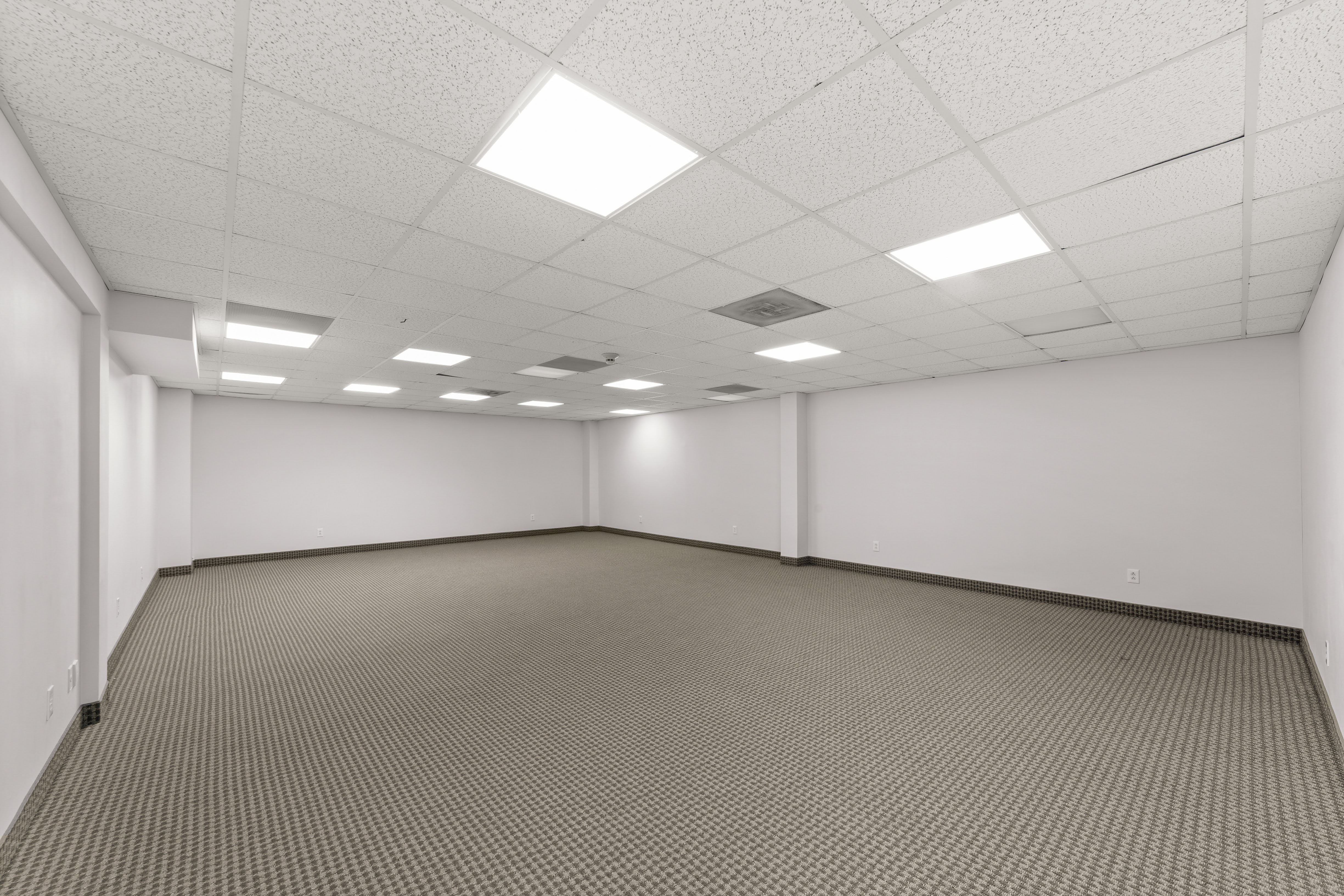 Empty commercial space with patterned carpet
