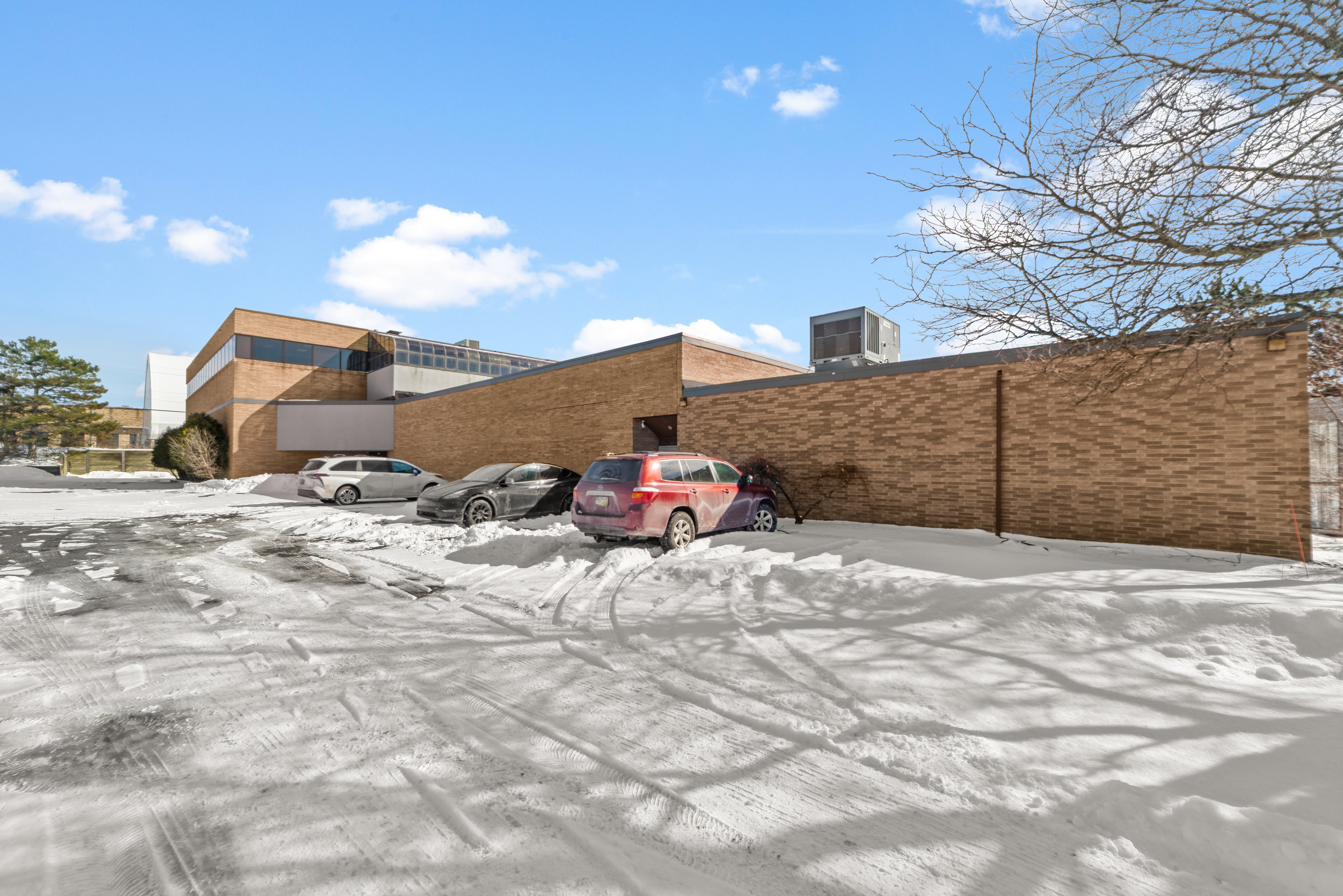 Brick building, snowy parking lot
