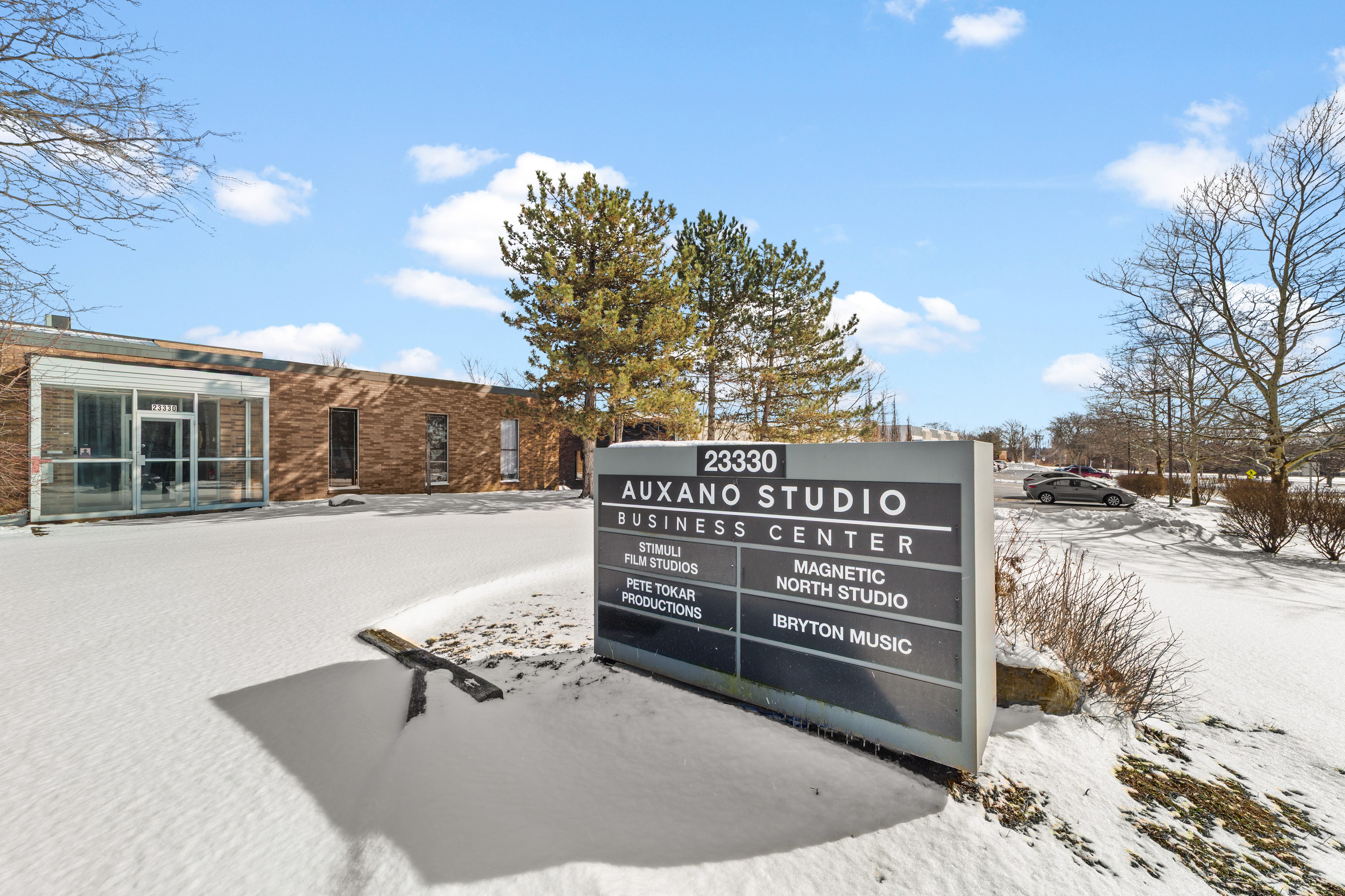 Snow-covered business center sign