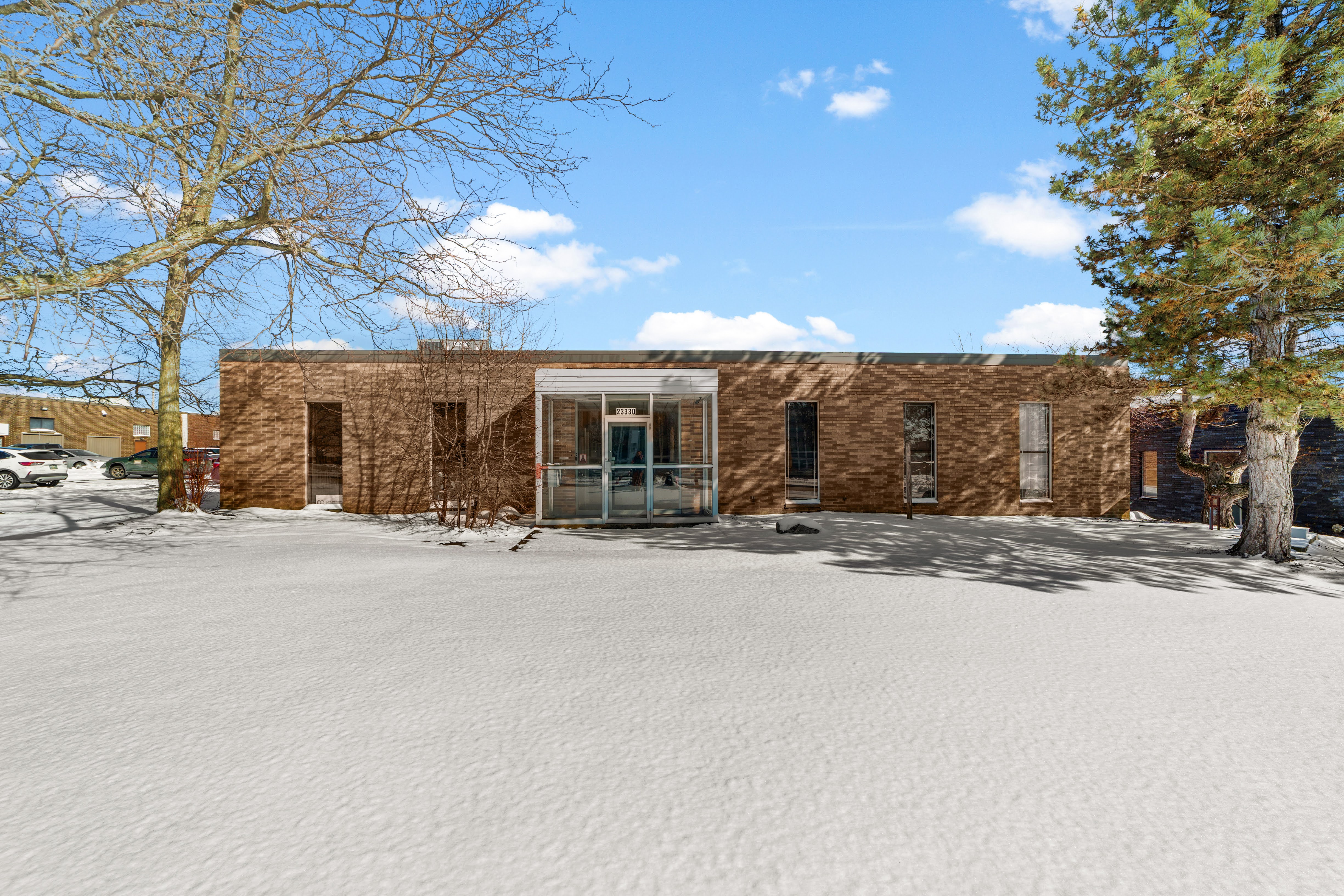 Brown brick building with glass entrance