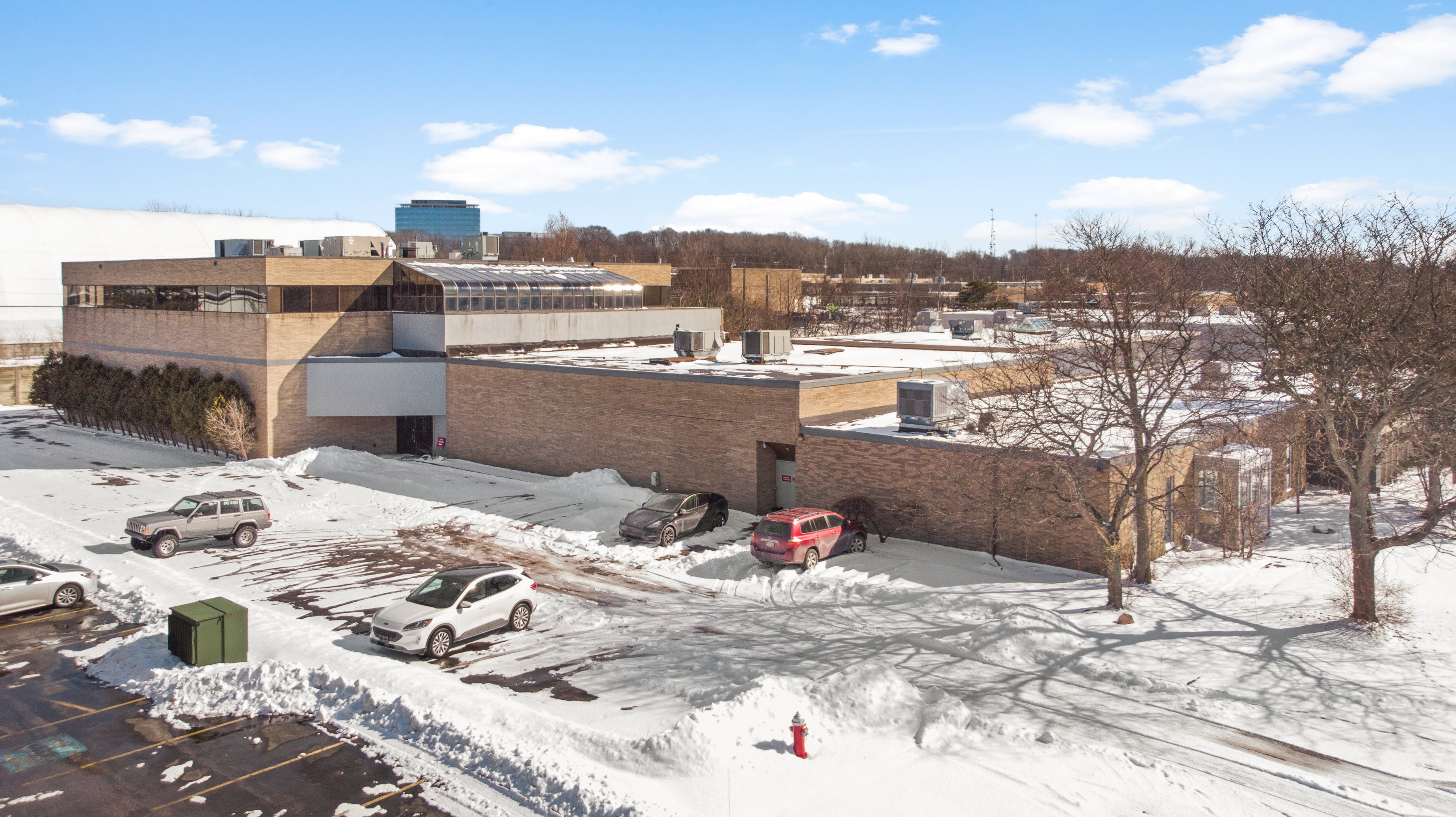 Aerial view of tan brick building complex